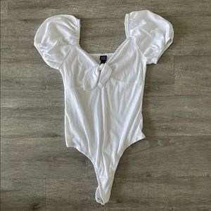White tied body suit